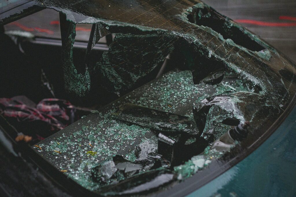 Broken car window in need for a car accident attorney Miami Florida.