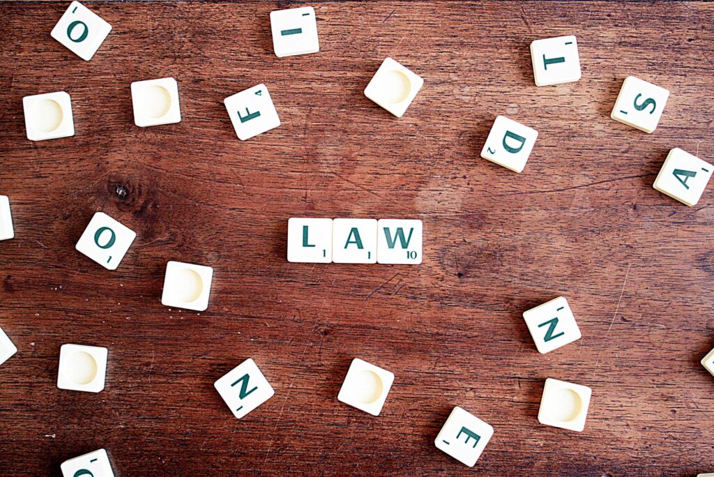 Image of scrabble tiles spelling "LAW," symbolizing a Miami law firm and its focus on professional legal services.