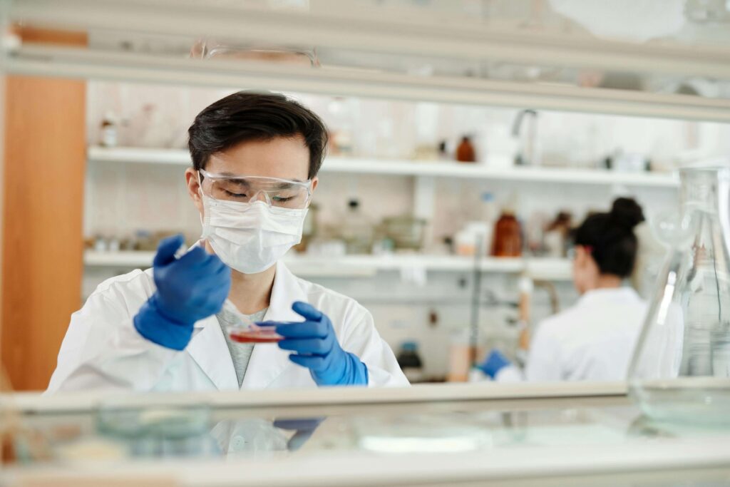 Understanding Medical Malpractice Claims: Lab technician working with samples to illustrate potential errors in medical settings.