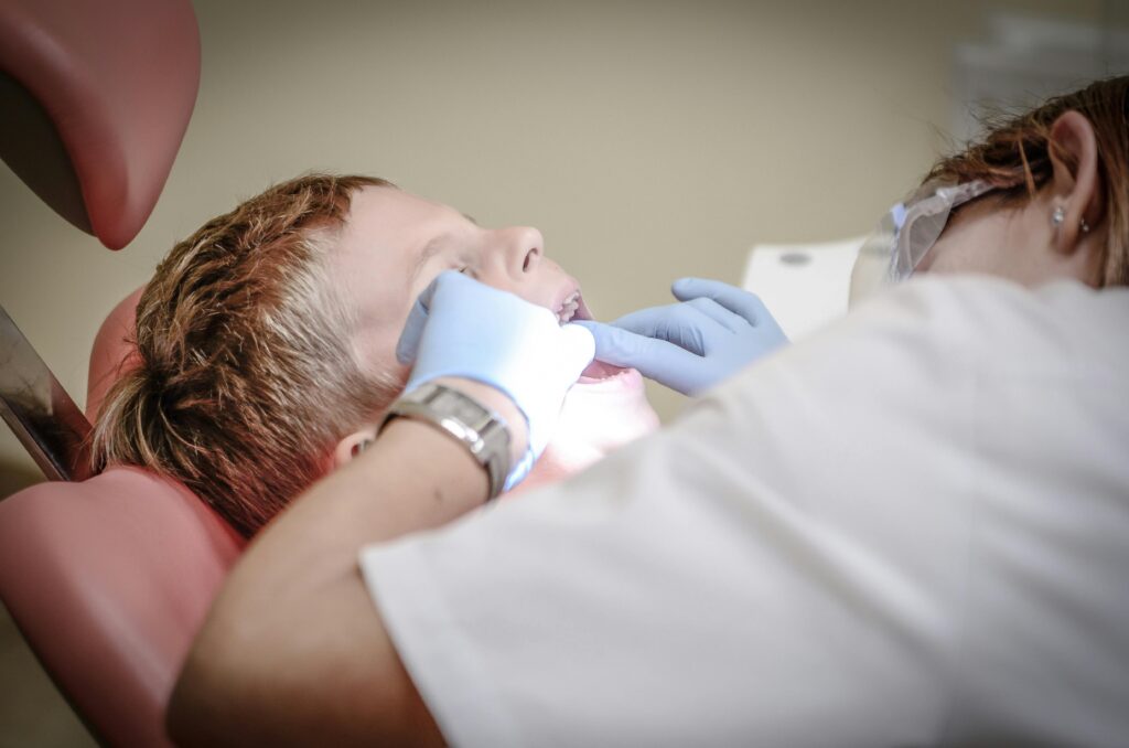 Dentist working on a patient's teeth, illustrating Understanding Medical Malpractice Claims