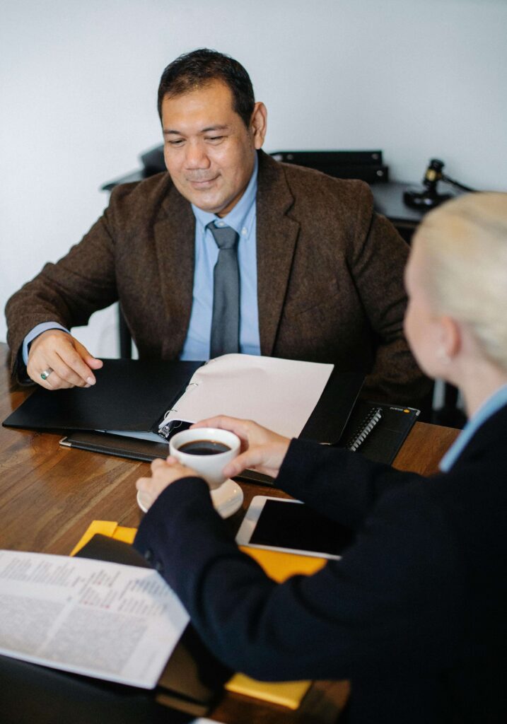 A client  discussing a case with an attorney, demonstrating tips on choosing a  personal injury attorney in Miami.
